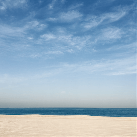Sunbathe on the Persian Gulf at Jumeirah Beach, five minutes away
