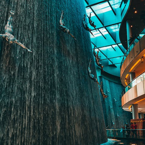 Tour the shops and attractions in the Dubai Mall, a short drive from here