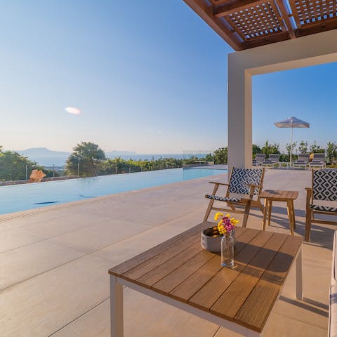 Enjoy expansive views across the coast whilst relaxing by the pool