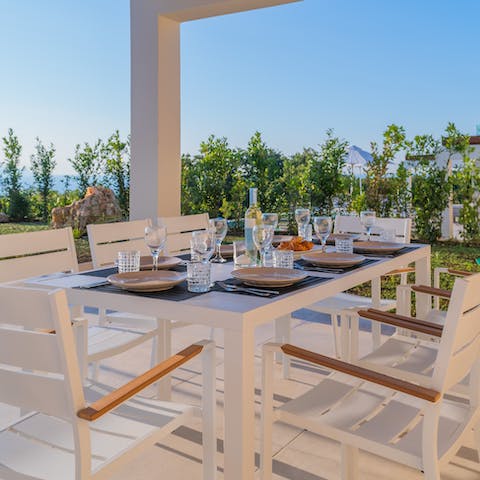 Gather for Cretan-inspired meals as the sun sets across the island