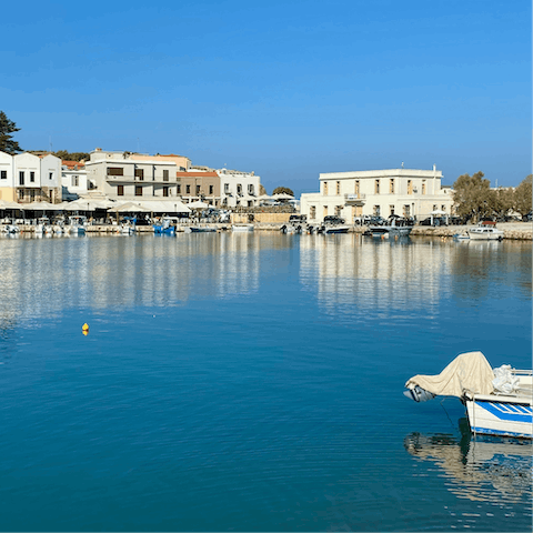 Stroll along the picturesque seafront of Rethymno – a short drive away