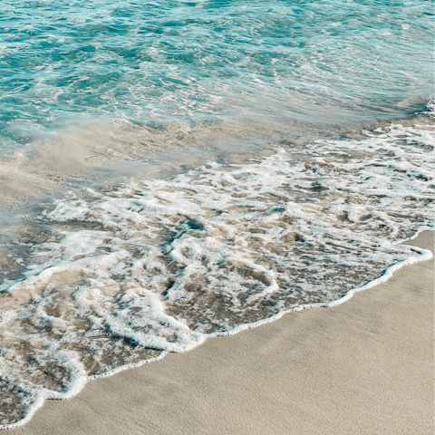 Spend an afternoon relaxing on the soft sands of Talamanca Beach, a seven-minute drive away