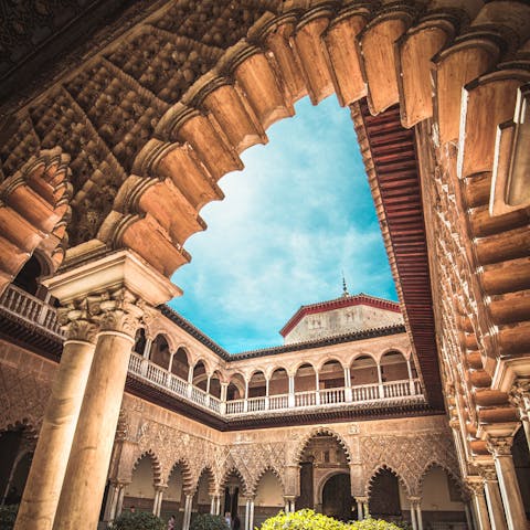 Make a visit to the Royal Alcázar of Seville, a short walk away