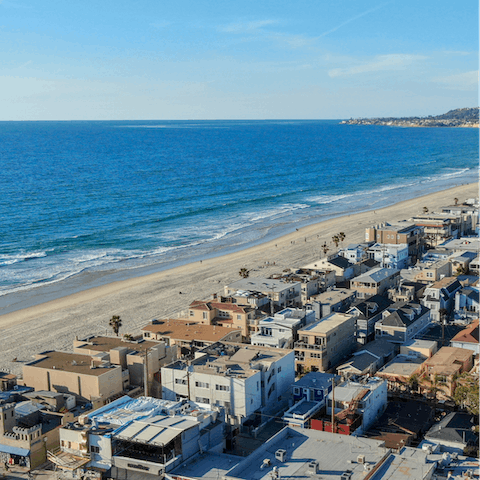 Walk over to the sandy shoreline of Pacific Beach in just ten minutes