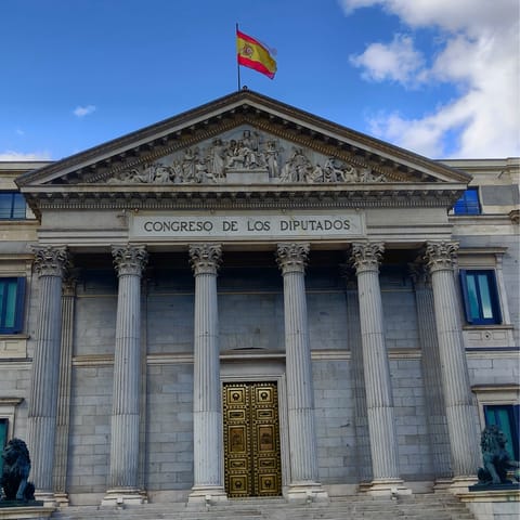 Admire the architecture in nearby Plaza de Las Cortes