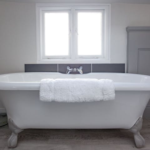 Soak in the clawfoot bathtub all evening with a glass of wine