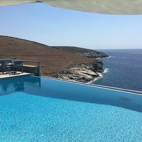 Plunge into the saline swimming pool overlooking Kea's volcanic headland
