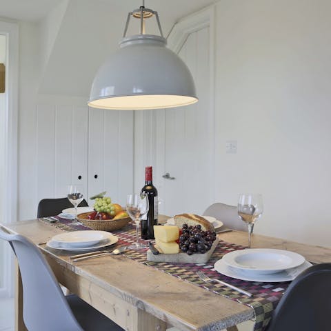 Gather around the lovely wood dining table for a meal all together