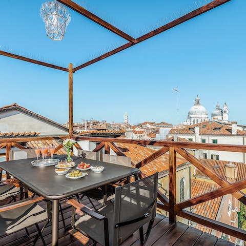 Admire breathtaking views of Downtown Venice from the rooftop terrace