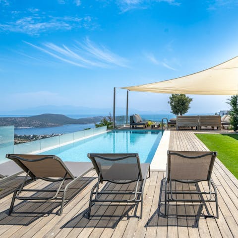 Enjoy blue-sky afternoons lounging by the private pool