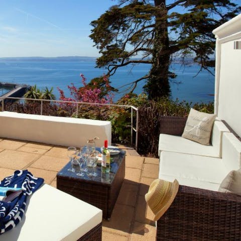Soak up the sun and sea views on your private patio