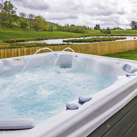 Take in the views of the duck pond from the hot tub