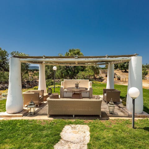 Sip a glass of local Itria Valley wine in the shade of your chic poolside gazebo