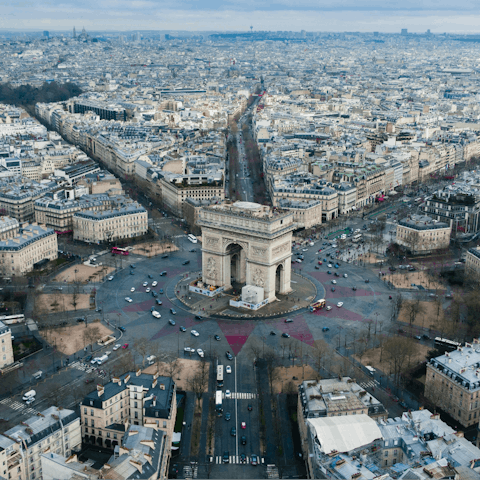 Stroll along the Champs-Elysées to the Arc de Triomphe 