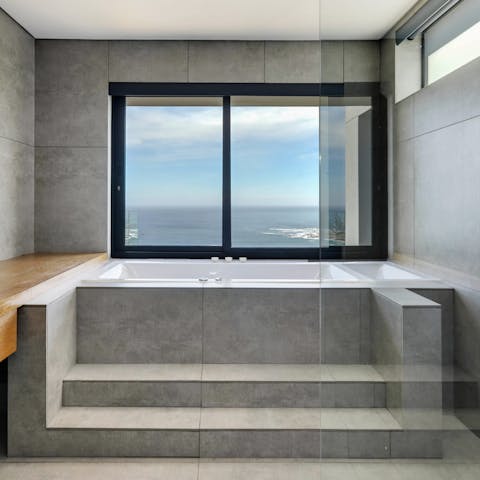 Look out to sea as you relax in your jacuzzi bathtub