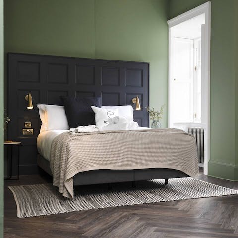 Get some rest in the bed with its stylish panelled headboard after a busy day in Edinburgh