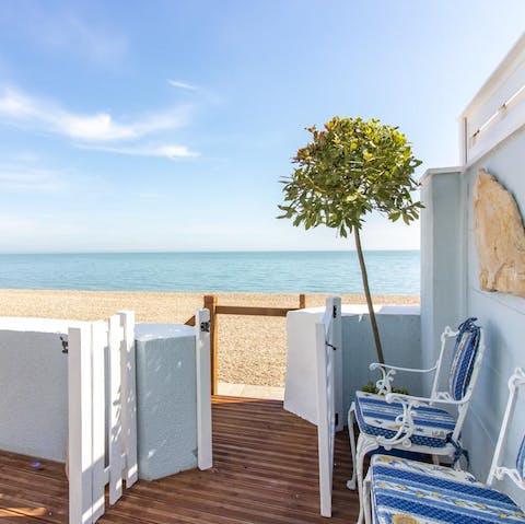Step off your terrace and right onto the pebbly beach 