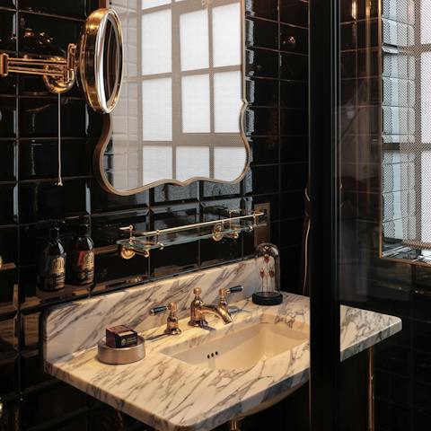 Get refreshed in the luxurious bathroom, with the large walk-in shower and antique brass finishes