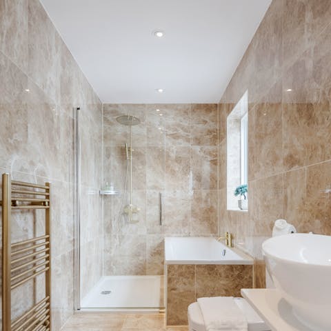 Get refreshed and rejuvenated in the bathtub and large walk-in shower