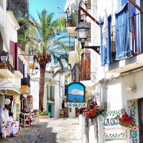 Explore the charming cobbled backstreets of Ibiza's Old Town, half an hour away
