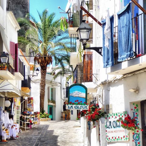 Explore the charming cobbled backstreets of Ibiza's Old Town, half an hour away