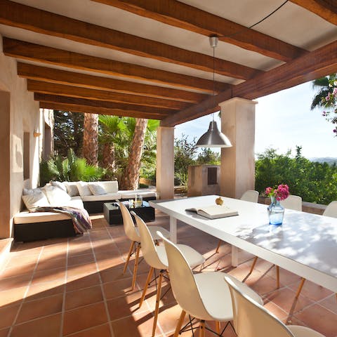 Entertain under the wood-beamed terrace