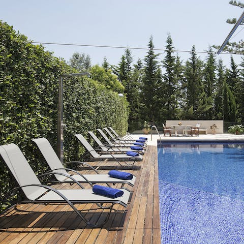 Spend your days lounging by the pool under the sun