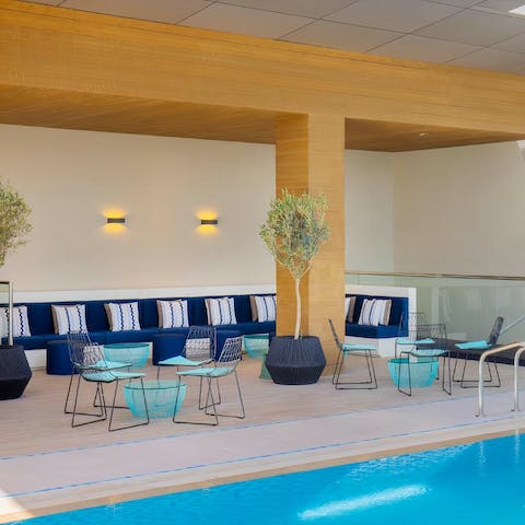 Chill with a drink and snacks in the cosy poolside bar
