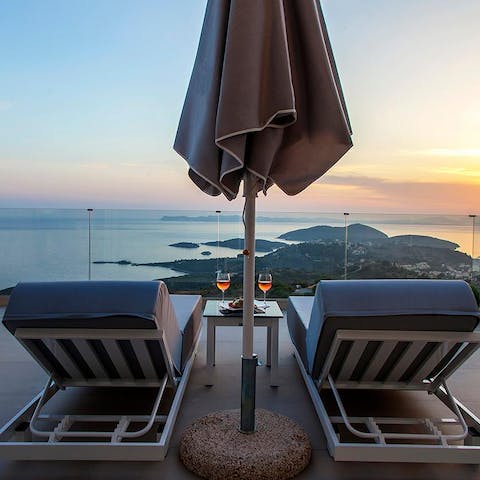 Pour yourself a glass of wine and watch the sunset from your enviable vantage point
