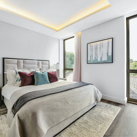 Wake up to views of the city from your comfy king size bed