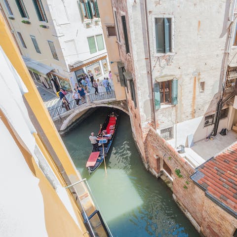 Listen to the gondoliers as they slide by beneath your window