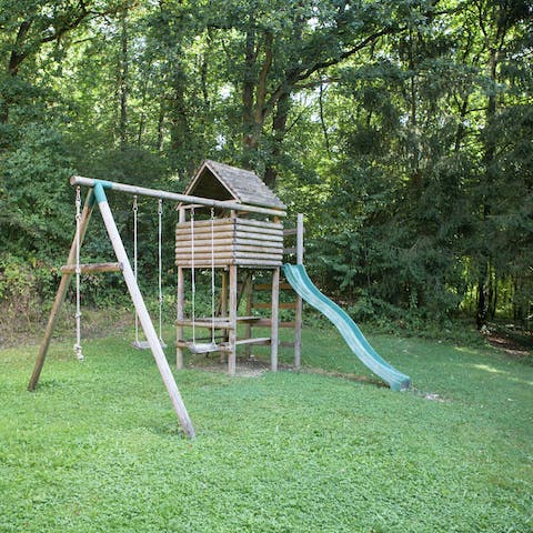 Let the kids play on the swings while you handle the barbecue
