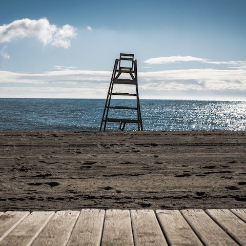 Go for a morning stroll along Playa de las Chapas, a short walk from home