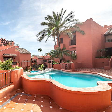 Soak up the Spanish sunshine as you lounge in the outdoor pool