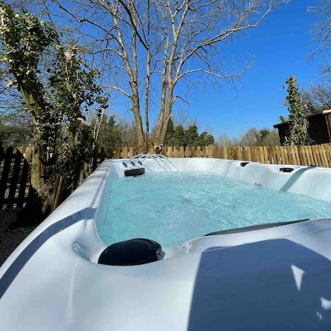 Relax in the hot tub after a walk around the private woodland