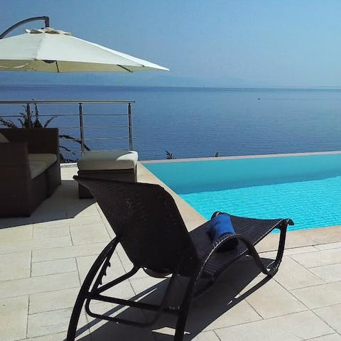 Swim laps of your infinity pool and drip dry on the sun loungers