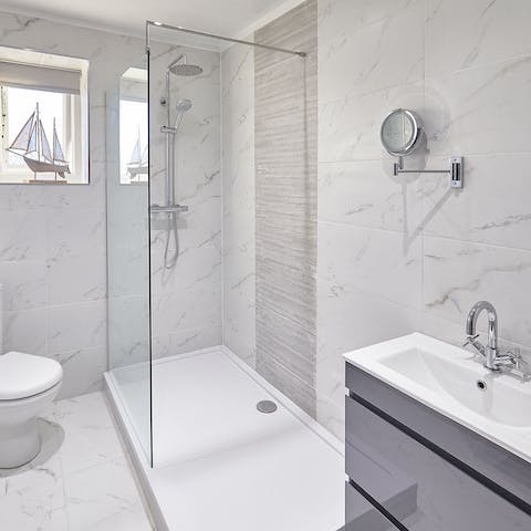 Freshen up in the huge rainfall shower in the marble bedroom