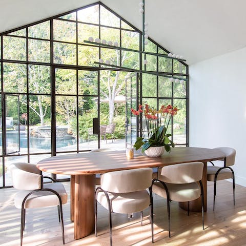 Host a dinner party in the elegant, light-filled dining room