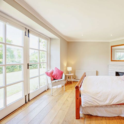 Step right out to the garden from the sun-soaked bedroom