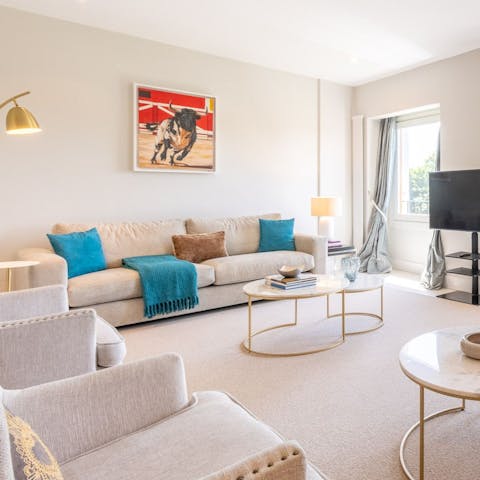 Relax in the bright and stylish living space after a busy day touring the city