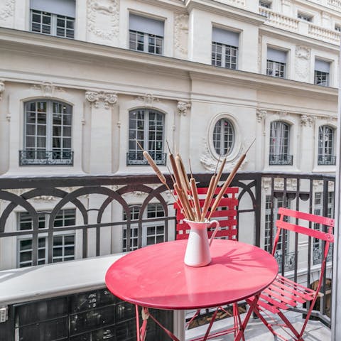 Sip your morning coffee on the petite balcony and watch the city wake up below