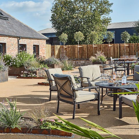 Enjoy drinks in the beautifully landscaped shared courtyard