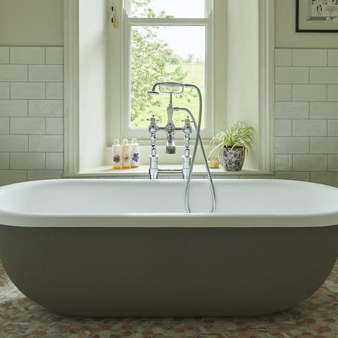 Treat yourself to a relaxing soak in the freestanding bathtub