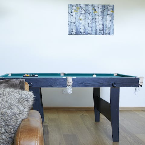 Play a game of snooker in the games room