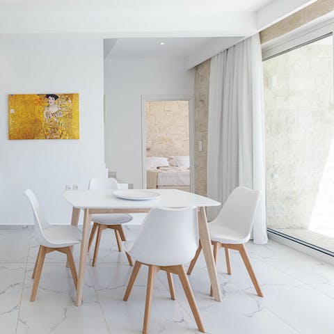 Share a Mediterranean spread around the modern dining table