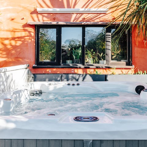Hop in the hot tub with a glass of something bubbly in hand