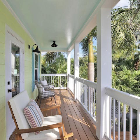 Take your morning coffee out to the balcony for a relaxed start to the day, overlooking the palm trees