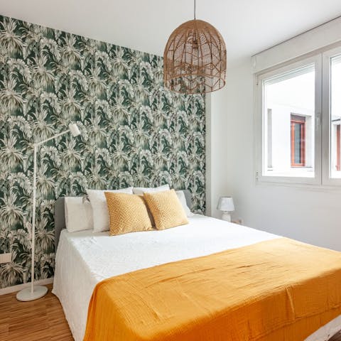 Wake up in the calm, beach-vibe bedroom feeling rested and ready for another day of Madrid sightseeing