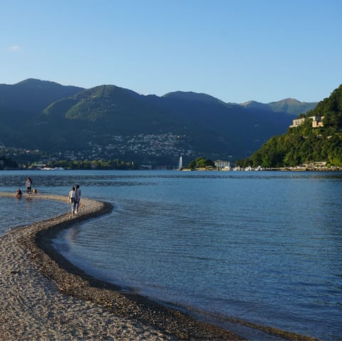 Cool off with a paddle in the water at Gravedona Beach