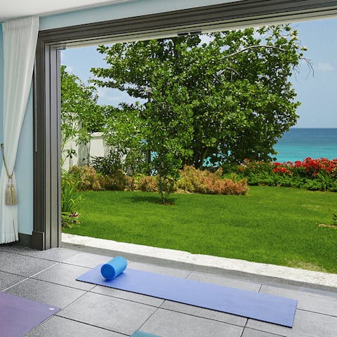 Stretch out to the sound of the ocean in the exercise room